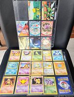 Front view showing nine Pokemon cards including Pikachu, Starmie, Lapras, and others arranged inside a plastic sleeve.
