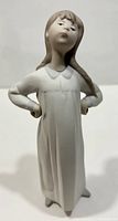 Full body front view of the matte figurine showing the girl in a nightgown with hands on hips.