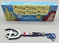Box and key showing Disney Little Mermaid Mystery Key Series Ursula design.