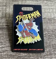 Photo of limited release Spider-Man enamel pin featuring Spider-Man in classic suit, mounted on a black backing card with Spider-Man logos and limited release text.