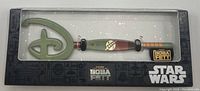 Collector key themed after Star Wars The Book of Boba Fett displayed on backing card with Disney and Star Wars branding.