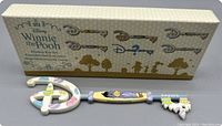 Box and boxed key figurine laid flat