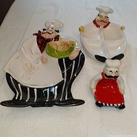 Photo of three ceramic fat chef themed kitchen items: chip and dip tray, 4-section serving plate, and soap holder figurine, all hand-painted with chef details.