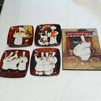 Photo shows four decorative square plates with humorous fat chef illustrations and one ceramic chef plaque.