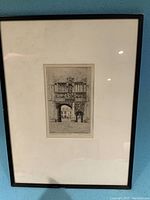 Framed etching showing an architectural building entrance with detailed arches and windows