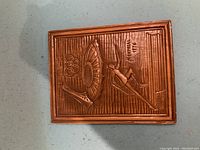 Bronze plaque with embossed Olympic rings, ski jumper, and Montreal 1976 Olympic emblem