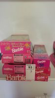 Stacked boxes showing Ribbon & Roses Barbie and Barbie Style dolls unopened in original packaging
