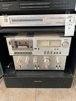 Yamaha AM/FM stereo tuner and Teac cassette deck stacked above Pioneer amplifier, all untested stereo equipment, with Technics speaker below.