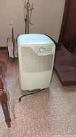 Front view of Simplicity dehumidifier showing air intake grille and control dial