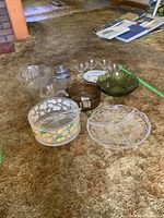 Overview of all serving dishes on carpet with kitchen background