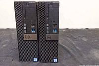 Front view of two Dell OptiPlex 5050 desktop computers side by side showing front panel ports and ventilation.