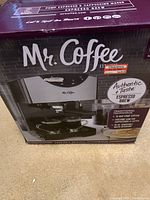 Box front showing Mr Coffee espresso maker with branding and key features
