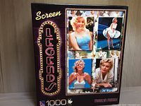 Photo of the sealed puzzle box showing four iconic images of Marilyn Monroe and 'Screen Legends' branding with 1000 pieces indicated.
