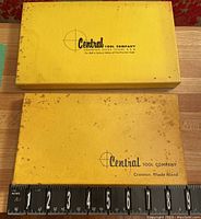 Two closed yellow boxes from Central Tool Company measuring about 9 inches for scale.
