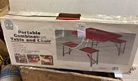 Box showing the product image and branding for a portable combination table and chair set.