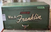 Closed view of green Snap-on cabinet with personalization and dimensions label
