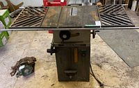 Full view of the Rockwell Beaver table saw showing cast iron top with dual extensions and base unit.