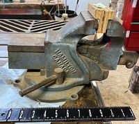 Side view showing the 'HAMILTON CANADA' marking and rotating base of the heavy-duty bench vice.