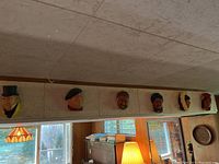 Overview of all six Bossons plaster wall heads mounted in a row