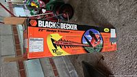 Photo of Black & Decker hedge trimmer box with branding and model shown.