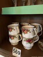 Six Royal Albert Old Country Roses coffee mugs arranged in two stacks of three.