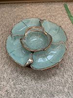 Top view showing the five turquoise and gold ceramic dishes arranged in a circular pattern on the Lazy Susan base.