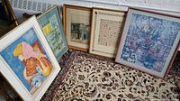Four framed artworks grouped, showing diversity in subject and styles including the girl lithograph, Edward Hopper print, calligraphy prayer, and floral print.