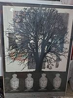 Frontal view of the lithograph artwork featuring a large black tree silhouette and four sculpted heads at the bottom with multi-colored abstract backgrounds.