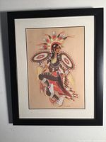 Framed colored lithograph of a Native American dancer by Woody Crumbo