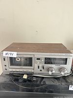 Front view of the Sanyo stereo cassette deck showing cassette compartment, analog tuner and controls.