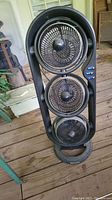 Front view of Honeywell triple fan tower showing all three circular fans stacked vertically.