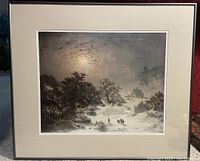 Overall view of the framed print depicting a winter night scene with snow, trees, houses, and figures, showing condition and presentation.