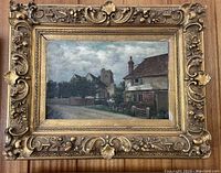 Full front view of the framed oil painting showing the church scene and ornate frame