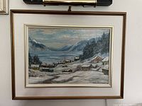 Full front view of framed winter landscape painting