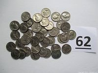 Photo displaying all 40 Bicentennial quarters piled together with an identification card