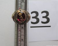 Front view on mandrel showing oval red enamel stone with gold Phi Alpha Psi letters and Ursinus College engraving around bezel
