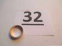 Ring placed next to lot number card