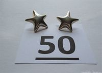 Front view of the pair of sterling silver star shaped post earrings on white background with lot number 50.
