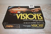 Box showing Visions brand, product image, and specifications including size and usage.