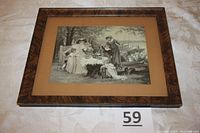 Framed woven silk picture showing the full artwork and frame from a slight angle.