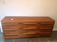 Front view showing all nine drawers and integrated handles