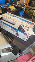 Photo showing Mastercraft 20 piece screwdriver and socket set box and part of plastic carrying case.