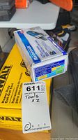 Mastercraft die grinder box on top of Dewalt cutout tool box, with MaxSold tag showing lot number 611