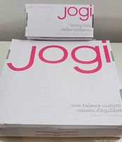 Closed packaging of Jogi core balance cushion and toning balls showing brand and product names.