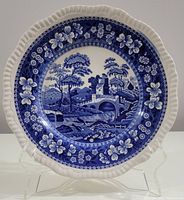 Front view of Spode Blue Tower dinner plate, showcasing central scenic tower and bridge design in blue.