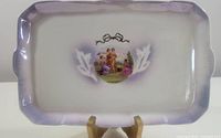 Overview of the rectangular porcelain tray with lavender gradient border and central decal of classical figures