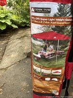 Photo of carrying bag with branding and description of the gazebo.