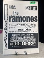 Black and white printed concert poster for The Ramones on board, approximately 11x17 inches, showing detailed ticket and event information from local vendors and radio station.
