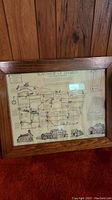 Full view of the framed map showing township boundaries of Hamlin, NY and decorative insets of buildings.
