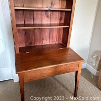 Front view of the solid cherry desk and shelving unit attached, showing the wood grain and craftsmanship.